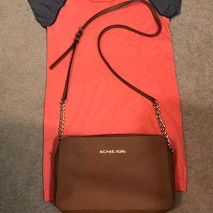 Michael Kors crossbody tan purse. 9.5by6.